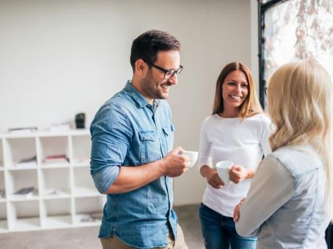 Image of teaching staff enjoying a chat over a coffee